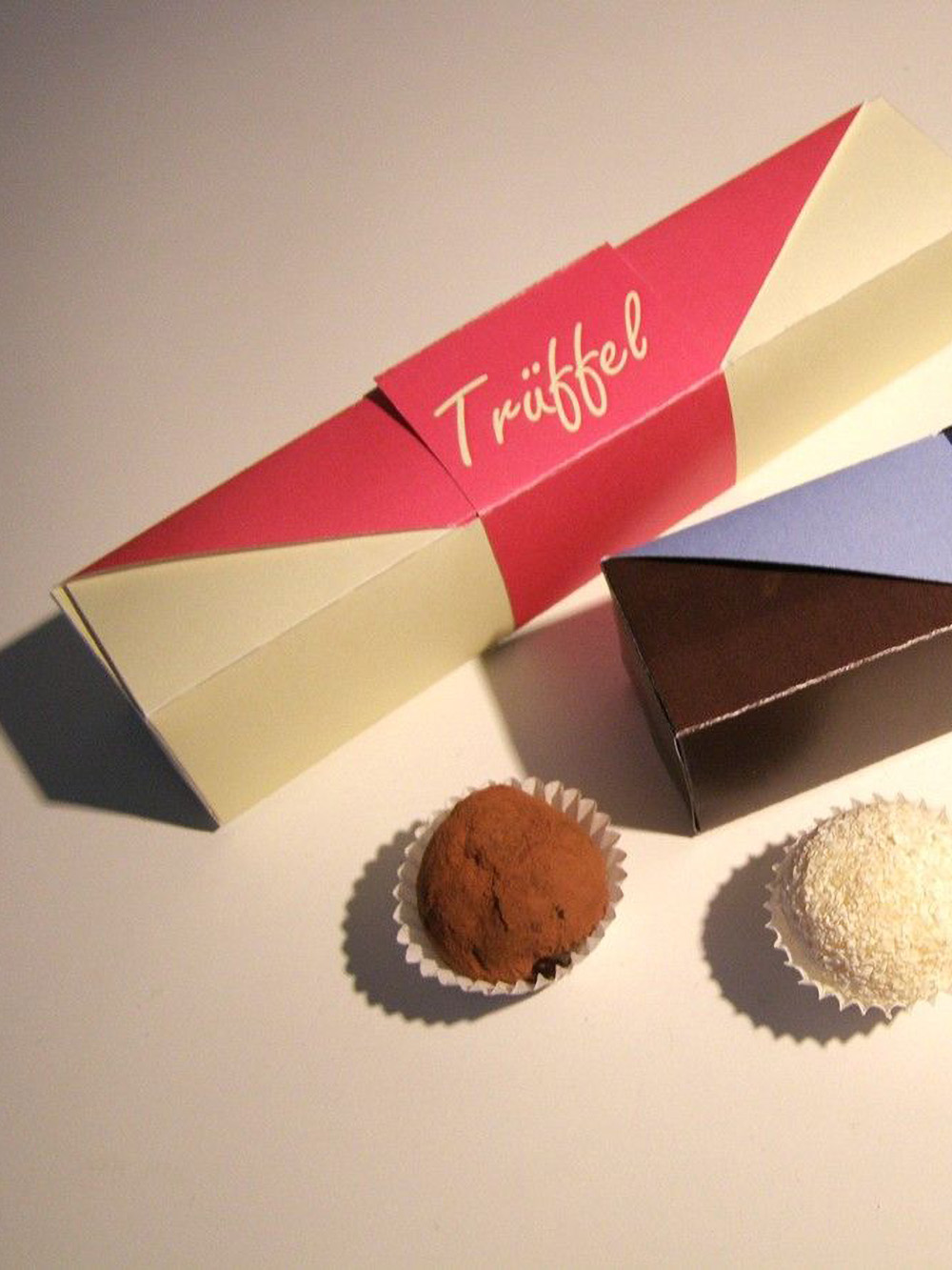 Personalised truffle packaging boxes with inserts made from premium cardboard for secure storage and elegant presentation