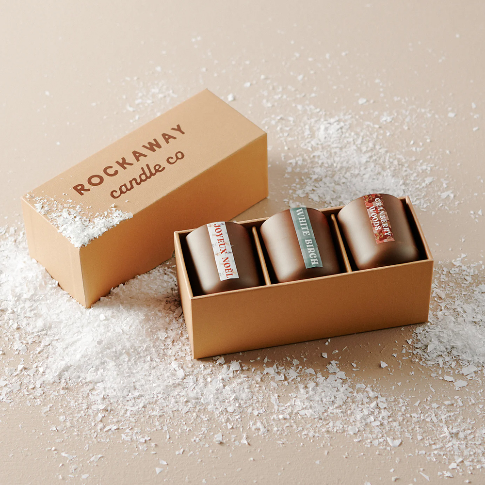 Luxury candle packaging boxes with custom inserts designed to hold scented candles safely during retail display and shipping
