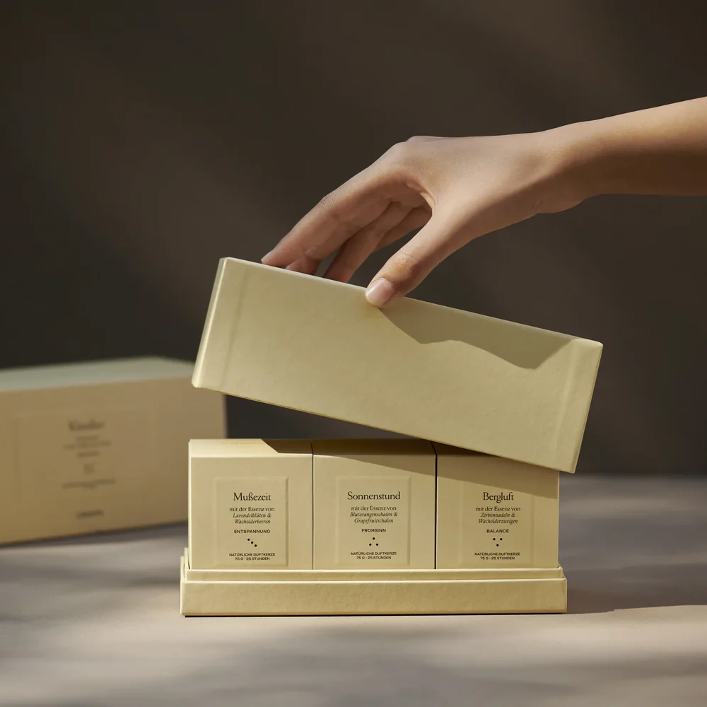 Bespoke rigid candle boxes with embossed branding for upscale retail and corporate gifting